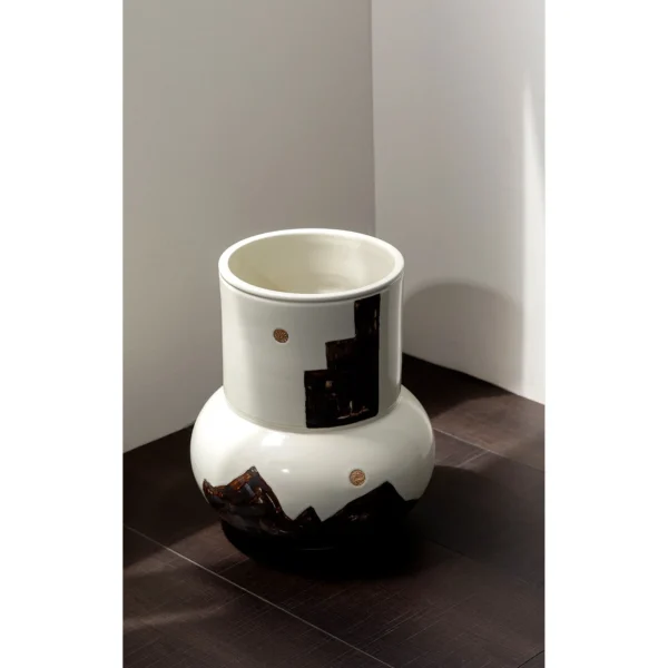 Hand-Painted Mountain Motif Cream Ceramic Vase in oatmeal — in a room setting