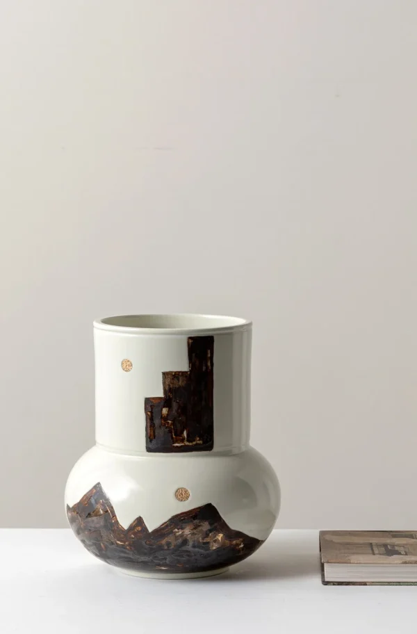 Hand-Painted Mountain Motif Cream Ceramic Vase in oatmeal — in a room setting