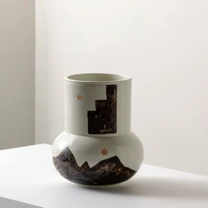 Hand-Painted Mountain Motif Cream Ceramic Vase in oatmeal — in a room setting
