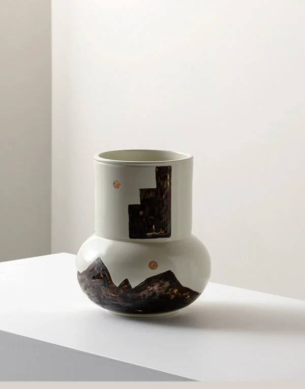 Hand-Painted Mountain Motif Cream Ceramic Vase in oatmeal — in a room setting