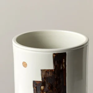 Hand-Painted Mountain Motif Cream Ceramic Vase in oatmeal — in a room setting