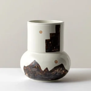 Hand-Painted Mountain Motif Cream Ceramic Vase in oatmeal — in a room setting
