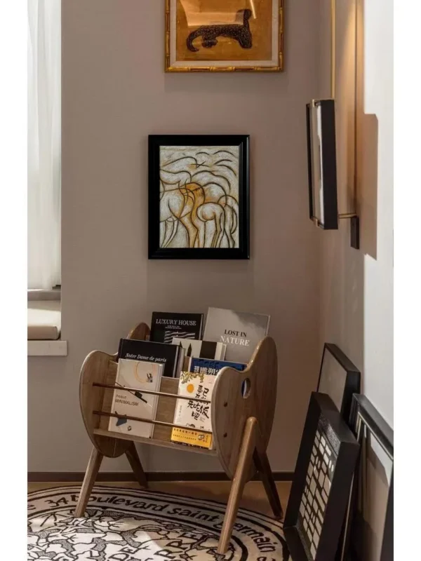 Hand Painted Gold Line Abstract Wall Art in Black Frame — in a room setting
