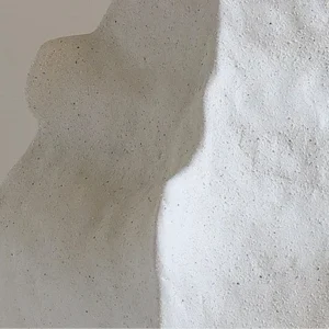 Designer Hand-Pinched Angular White Ceramic Vase, Small or in ivory — in a room setting