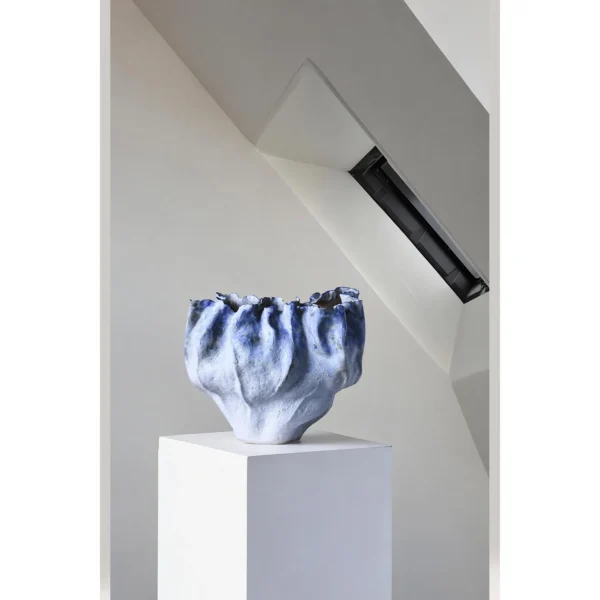 Hand-Pinched Pleated Blue-Grey Stoneware Vase in blue — in a room setting
