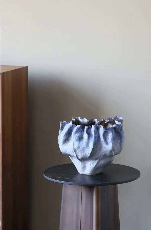 Hand-Pinched Pleated Blue-Grey Stoneware Vase in blue — in a room setting