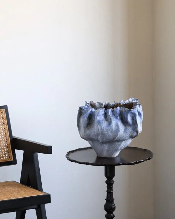 Hand-Pinched Pleated Blue-Grey Stoneware Vase in blue — in a room setting