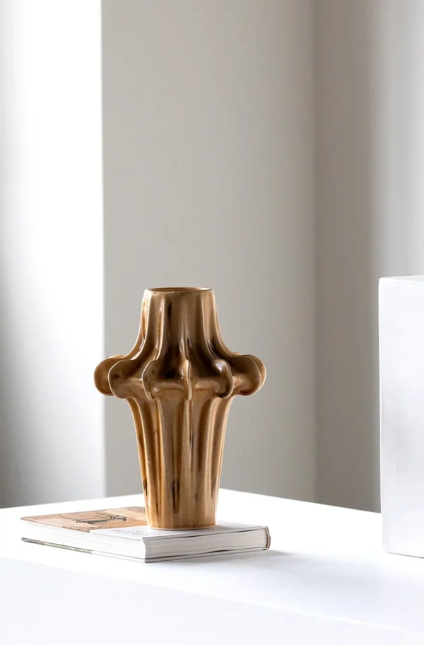 Hand-Sculpted Four-Lobed Stoneware Vase in Caramel Glaze — in a room setting