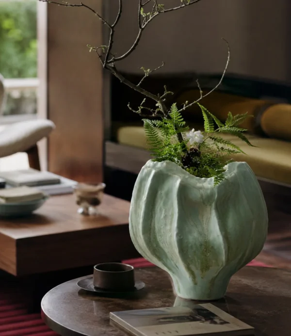 Hand-Sculpted Multi-Edged Stoneware Vase in Celadon Green — in a room setting