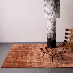 Hand-Textured Wool Rug in Rust Red — in a room setting