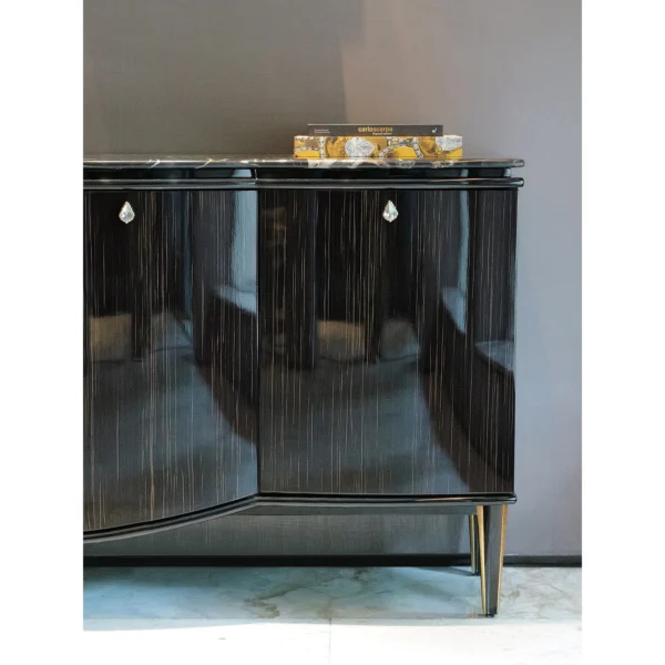 Gloss Ebony Sideboard with Marble Top and Crystal Pulls in black — in a room setting