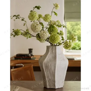 Designer Irregular Faceted White Ceramic Vase, Small or in ivory — in a room setting
