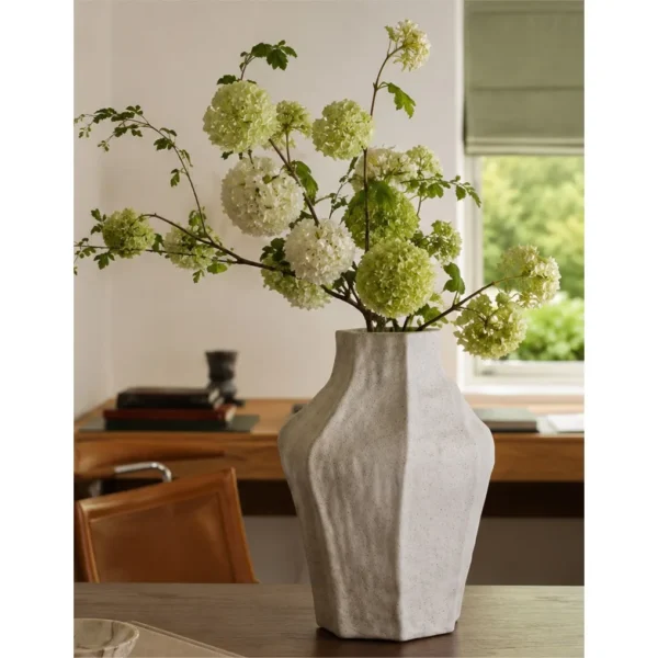 Designer Irregular Faceted White Ceramic Vase, Small or in ivory — in a room setting