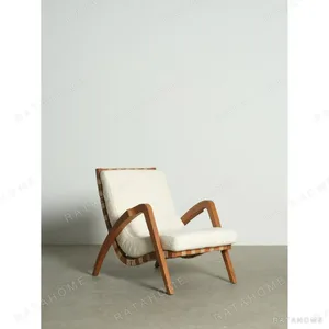Burmese Teak Armchair in clay — in a room setting