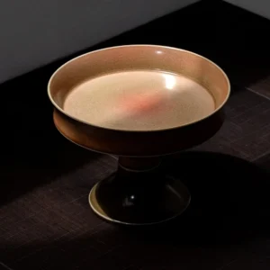 Kiln-Glazed Footed Ceramic Fruit Plate in bronze — front view