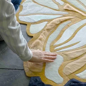 Hand-Made Marbled Cowhide Rug in Navy, Cream and Tan — in a room setting