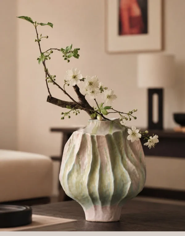 Hand-Made Pleated Ceramic Vase in Moss and Rose Glaze — in a room setting