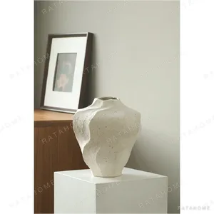 Hand-Made Rock Texture Ceramic Vase in ivory — in a room setting