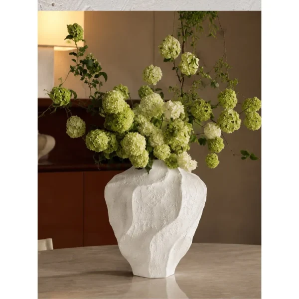 Designer Rock Texture Folded Ceramic Vase, Short in ivory — in a room setting