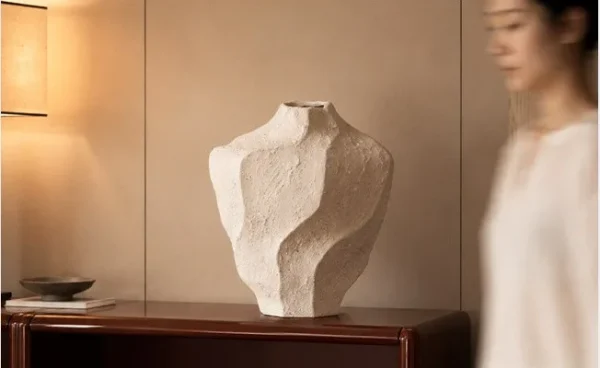 Designer Rock Texture Folded Ceramic Vase, Short in ivory — in a room setting