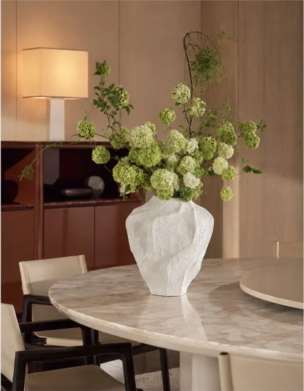 Designer Rock Texture Folded Ceramic Vase, Short in ivory — in a room setting