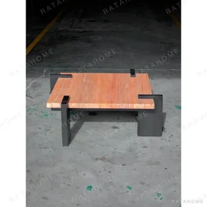 Red Travertine Coffee Table on Black Bracket Legs in rust — in a room setting