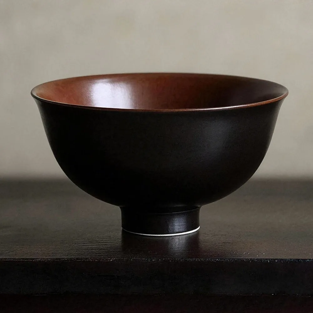 Hand-Made Two-Tone Footed Rice Bowl in Black and Rust — front view