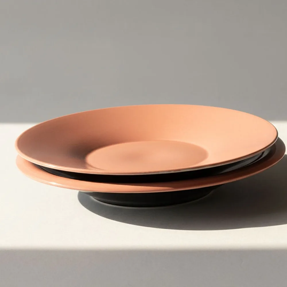 Hand-Thrown Peach Mist Ceramic Plates and Bowl in rose stone — front view