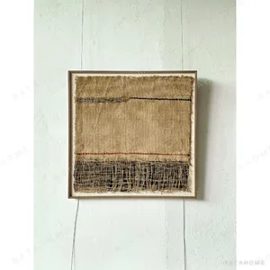 Handwoven Jute Textile Wall Art in Natural and Indigo — in a room setting