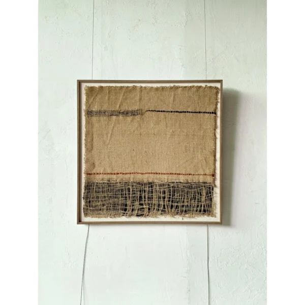 Handwoven Jute Textile Wall Art in Natural and Indigo — in a room setting