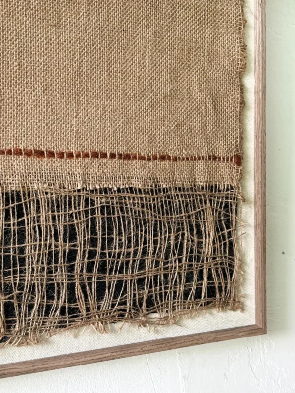 Handwoven Jute Textile Wall Art in Natural and Indigo — in a room setting