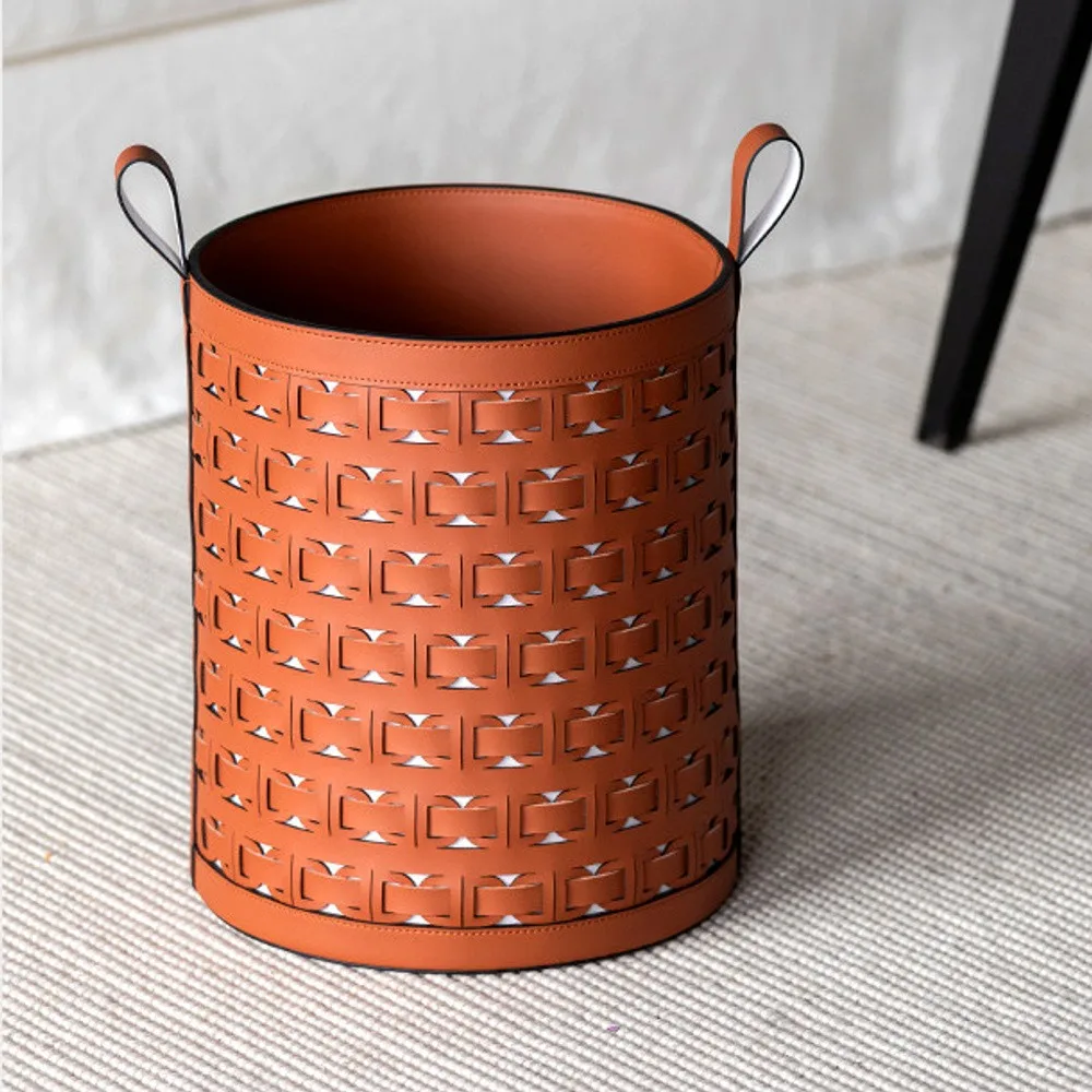 Hand-Woven Orange Leather Laundry Basket with Handles in rust — front view