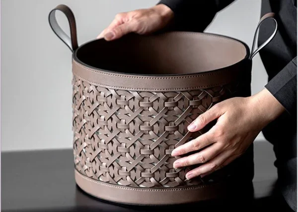 Hand-Woven Leather Storage Basket with Handles in slate — in a room setting
