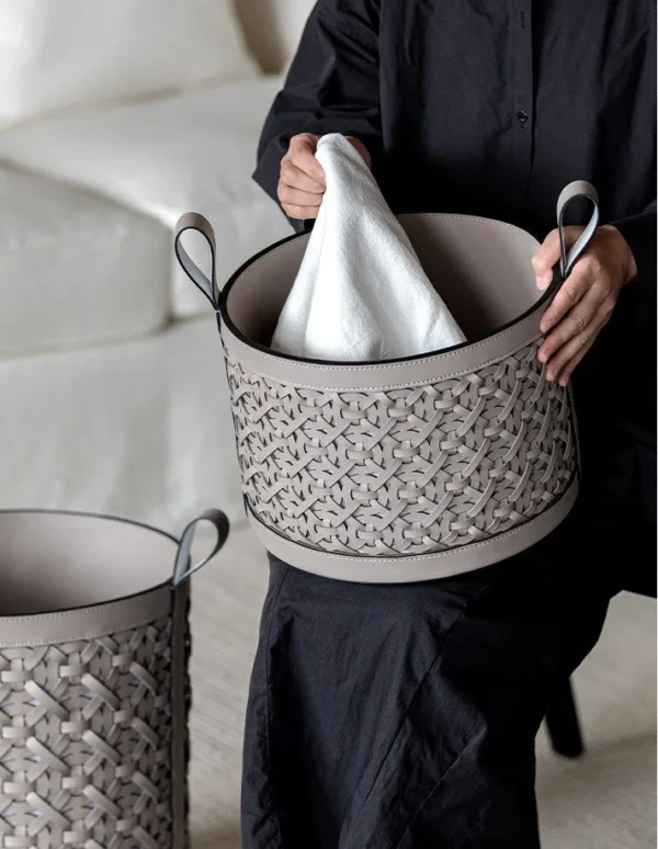Hand-Woven Leather Storage Basket with Handles in slate — in a room setting