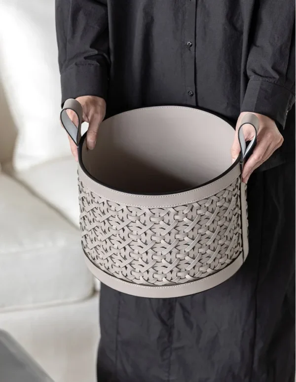 Hand-Woven Leather Storage Basket with Handles in slate — in a room setting
