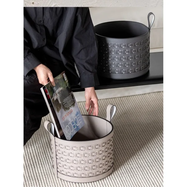 Hand-Woven Black Leather Storage Bucket with Loop Handles in black — in a room setting