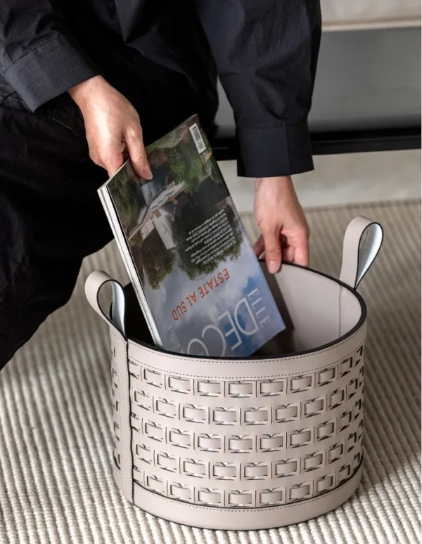 Hand-Woven Black Leather Storage Bucket with Loop Handles in black — in a room setting