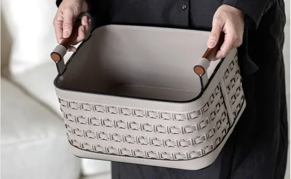 Hand-Woven Leather Storage Basket with Wood Handles in slate — in a room setting