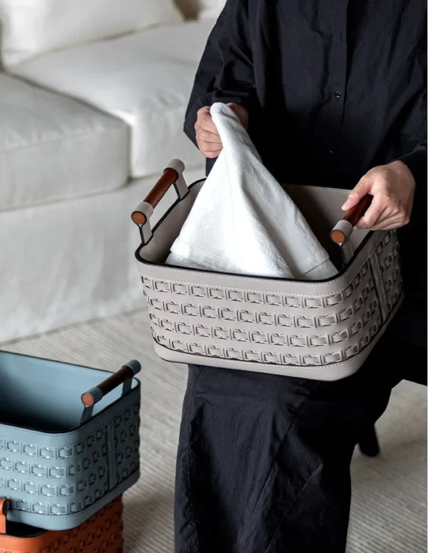 Hand-Woven Leather Storage Basket with Wood Handles in slate — in a room setting