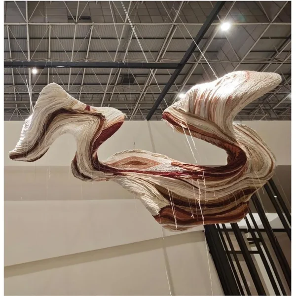 Suspended Twisting Ribbon Art Installation, 304 x 172 cm in oatmeal — in a room setting