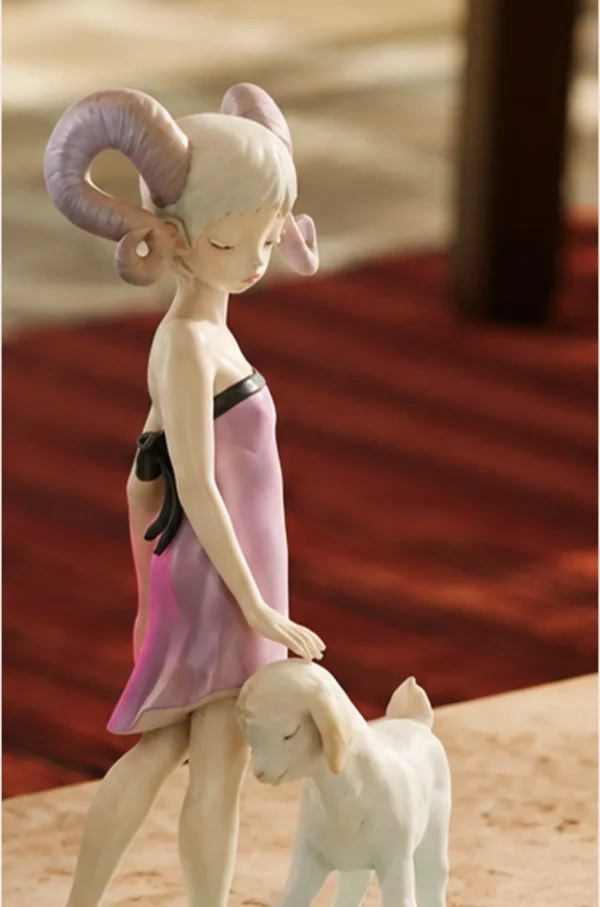 Horned Girl with Lamb Art Figurine in Resin — in a room setting
