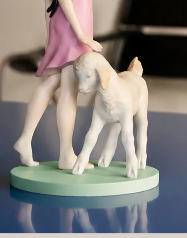 Horned Girl with Lamb Art Figurine in Resin — in a room setting
