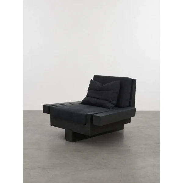 Charred Black Oak Saddle Stool in black — in a room setting