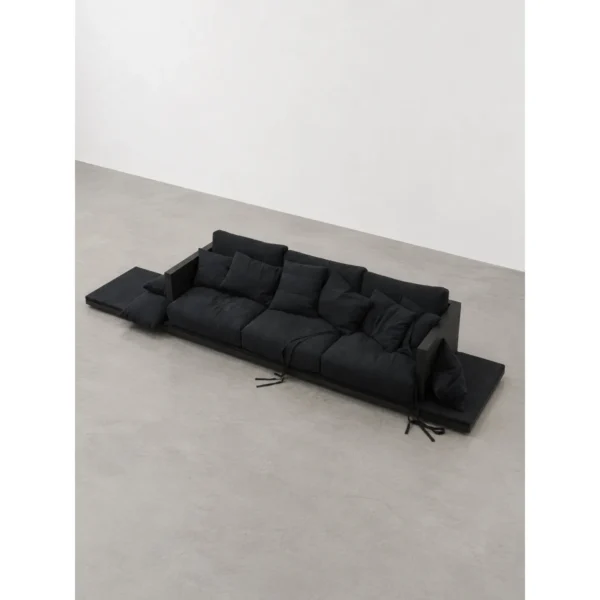 Charred Black Oak Saddle Stool in black — in a room setting