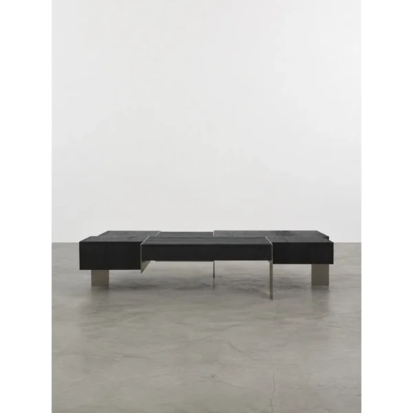 Charred Black Oak Saddle Stool in black — in a room setting