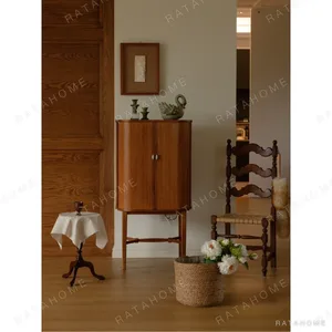 Baolu Teak Cabinet with Lit Interior and Ceramic Pulls in clay — in a room setting