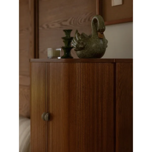 Baolu Teak Cabinet with Lit Interior and Ceramic Pulls in clay — in a room setting