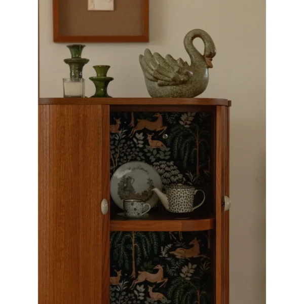 Baolu Teak Cabinet with Lit Interior and Ceramic Pulls in clay — in a room setting