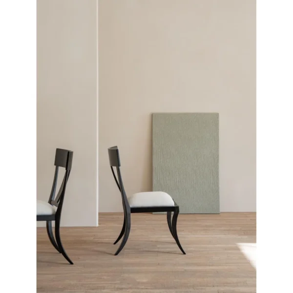 Hera Black Ash Curved-Leg Dining Chair with Linen Seat in black — in a room setting