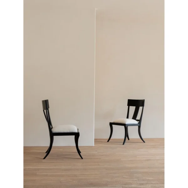 Hera Black Ash Curved-Leg Dining Chair with Linen Seat in black — in a room setting